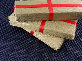 Image showing golden gift box with red ribbon, holiday concept