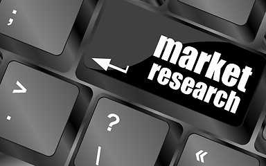 Image showing key with market research text on laptop keyboard, business concept