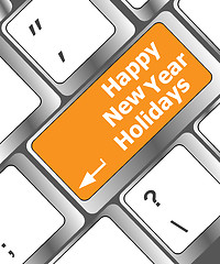 Image showing happy new year holidays button on computer keyboard key