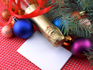 Image showing champagne bottle with christmas ball and red ribbon, invitation card