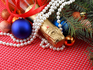 Image showing champagne bottle with christmas ball and white diamonds, invitation card