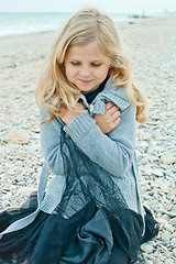 Image showing pretty girl at the autumn beach 