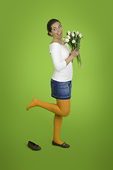 Image showing Happy girl with tulips