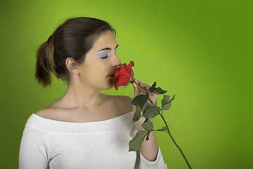 Image showing Smelling a rose