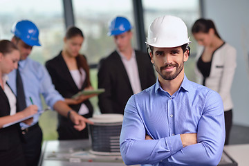 Image showing business people and engineers on meeting