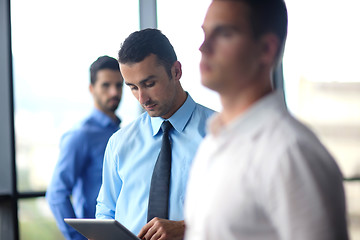 Image showing business man using tablet compuer at office