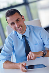 Image showing business man using tablet compuer at office