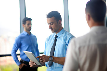 Image showing business man using tablet compuer at office