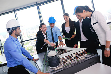 Image showing business people and engineers on meeting