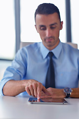 Image showing business man using tablet compuer at office