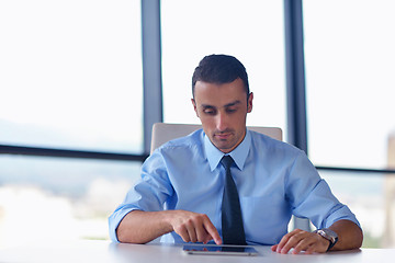 Image showing business man using tablet compuer at office