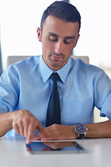 Image showing business man using tablet compuer at office