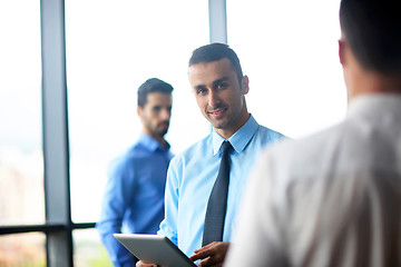 Image showing business man using tablet compuer at office