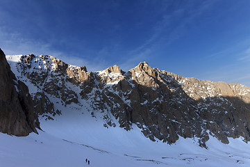 Image showing Hikers on snowy mountains in morning