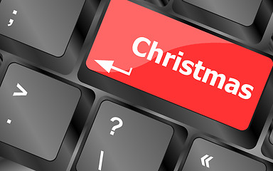 Image showing christmas button on the keyboard key - holiday concept