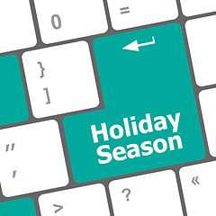 Image showing holiday season button on modern internet computer keyboard key