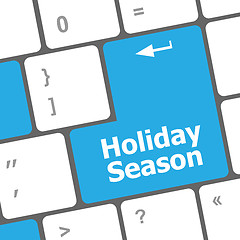 Image showing holiday season button on modern internet computer keyboard key