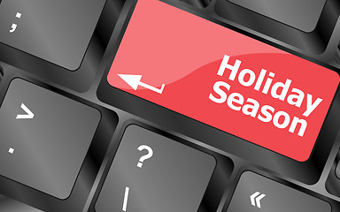 Image showing holiday season button on modern internet computer keyboard key