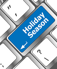 Image showing holiday season button on modern internet computer keyboard key