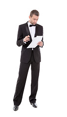 Image showing Man in a tuxedo reading the document