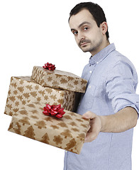 Image showing Young man holding a present