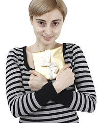 Image showing Young woman holding a present