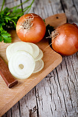 Image showing fresh onions, knife, and parsley 