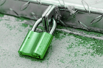 Image showing A padlock on an iron door