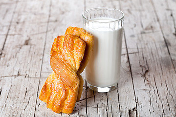 Image showing glass of milk and fresh baked buns 