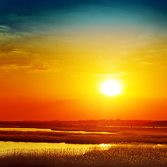 Image showing golden sunset over river