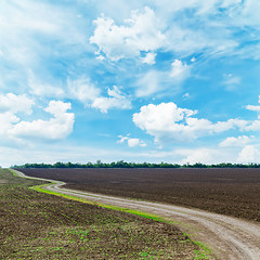 Image showing winding rural road under dramatic sky