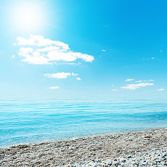 Image showing sun in blue sky over sea