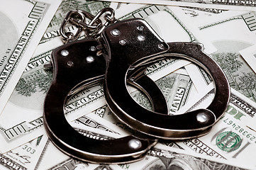 Image showing Dollars and handcuffs