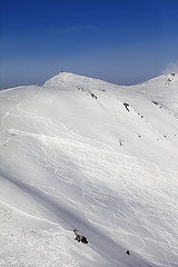 Image showing Off-piste ski slope with traces