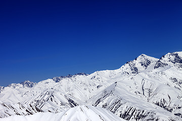 Image showing Winter snowy mountains and blue sky