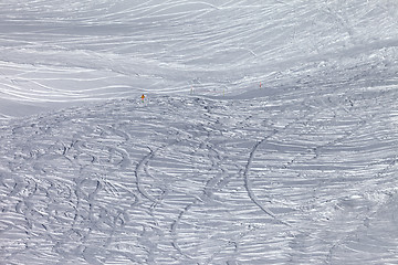 Image showing Traces of skis and snowboards in new-fallen snow on off-piste sl