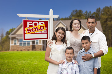 Image showing Hispanic Family, New Home and Sold Real Estate Sign