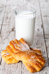 Image showing glass of milk and two fresh baked buns 