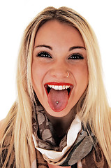 Image showing Girl showing pierced tongue.