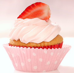Image showing Vanilla cupcake with stawberry frosting and strawberriy