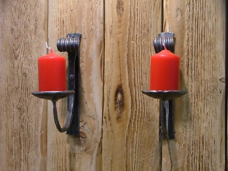 Image showing couple of red candles in their holders