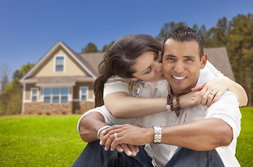 Image showing Happy Hispanic Young Couple in Front of Their New Home