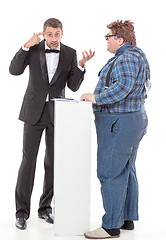 Image showing Elegant man arguing with a country yokel
