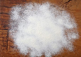 Image showing white flour on wooden table