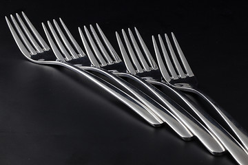 Image showing Forks on a black table