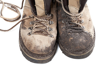 Image showing Old dirty trekking boots isolated on white background
