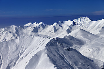 Image showing View on off-piste snowy slopes at nice sunny day