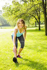 Image showing Woman stretching in park