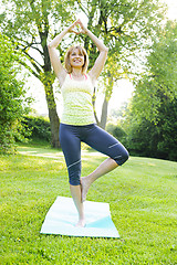 Image showing Woman in yoga tree pose