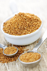 Image showing Coconut palm sugar in measuring spoons